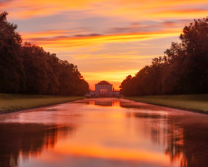 Germany, Bavaria, view from the middle channel to the Nymphenburg Palace at sunrise Germany, Bavaria, view from the middle channel to the Nymphenburg Palace at sunrise